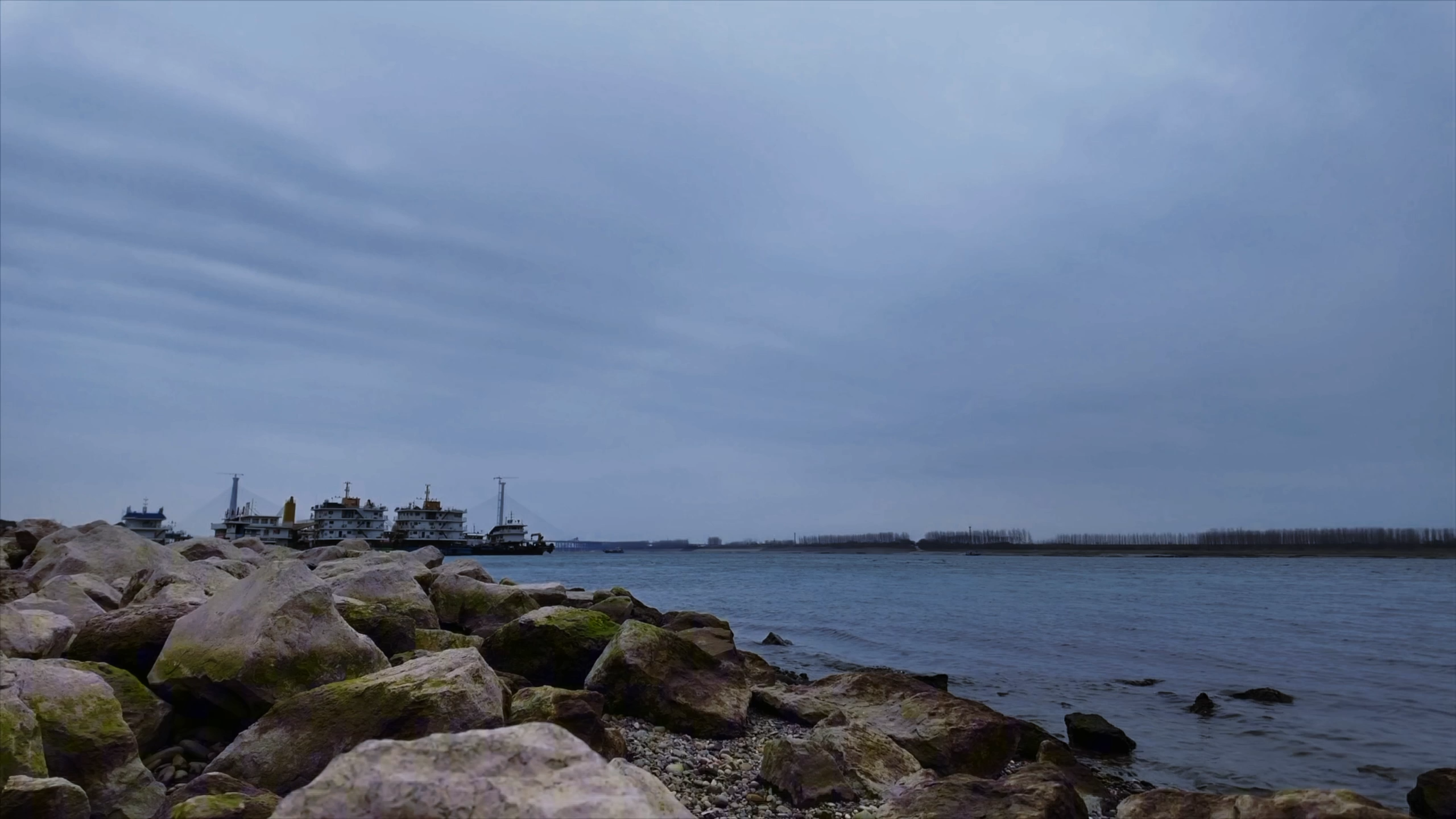 Rocky shoreline beneath an open sky